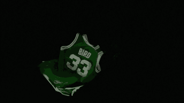 a green celtics jersey with the number 23 on it