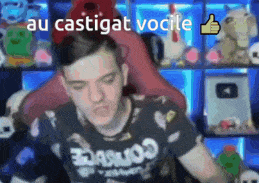 a blurry picture of a man with the words au castigat vocile behind him