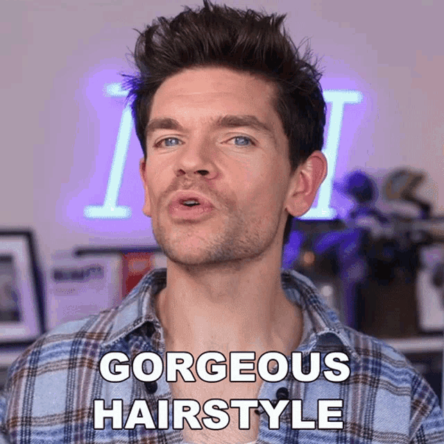 a man is wearing a plaid shirt and says " gorgeous hairstyle "