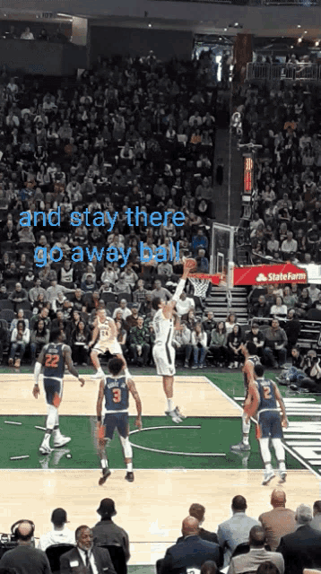 a basketball game is being played in front of a crowd with the words " and stay there go away ball "