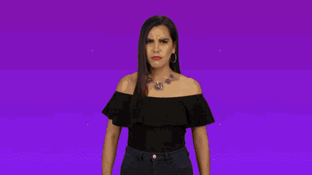 a woman in a black off the shoulder top is surrounded by angry emoticons