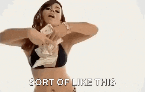 a woman in a bikini is holding a bunch of money in her hands .