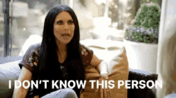 a woman is sitting on a couch with the words `` i don 't know this person '' .