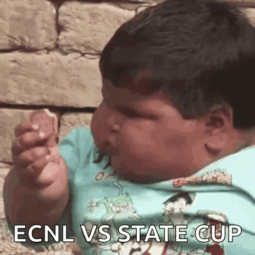 a baby is eating a cookie with the words ecnl vs state cup written on it .