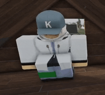 a person wearing a blue hat with a k on it