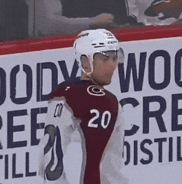 a hockey player wearing a number 20 jersey