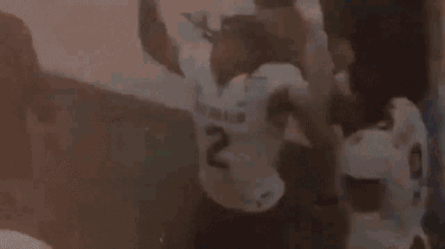 a man wearing a colorado jersey is dancing on a field