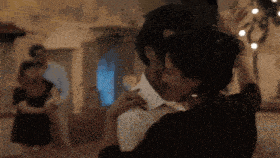 a blurry picture of a man and woman dancing