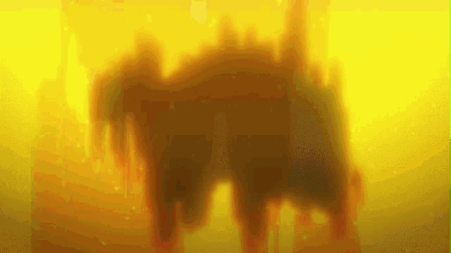 a yellow background with a silhouette of a castle in the foreground