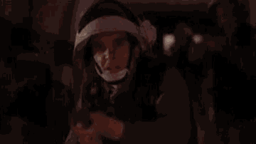 a red light is coming out of a person 's mouth .