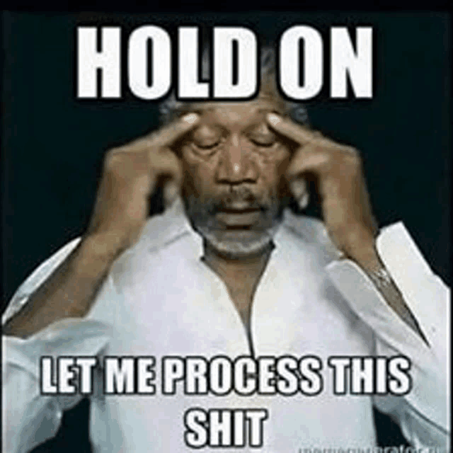 a man is holding his head with his hands while making a funny meme .