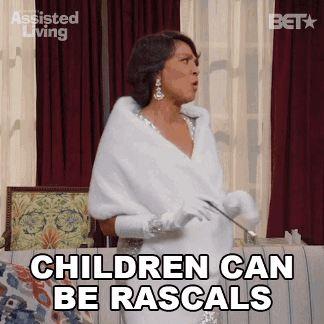a woman says children can be rascals while wearing a white fur coat