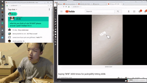 a man is sitting at a table in front of a computer screen with a youtube page open