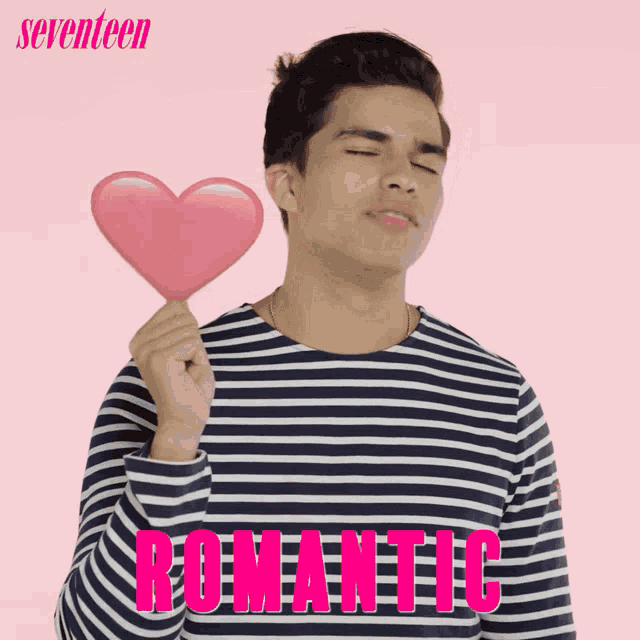 a man in a striped shirt is holding a heart in his hand and the word romantic is on the bottom right