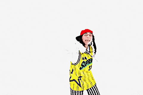 a woman wearing a yellow jersey that says supreme