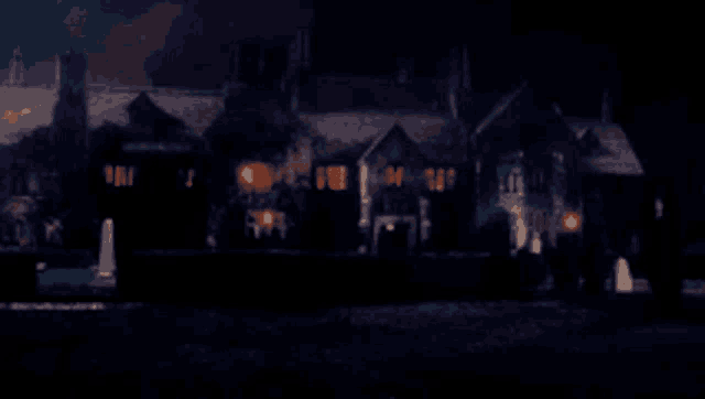a blurry picture of a house at night with a lot of lights on