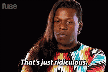 a man with long hair is wearing a colorful sweater and says that 's just ridiculous .