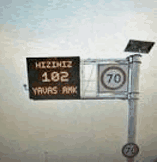 a sign with a solar panel on top of it that says 70 on it .