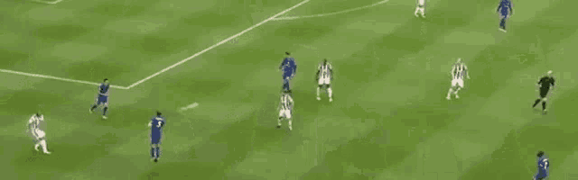 a group of soccer players are playing a game of soccer on a field .