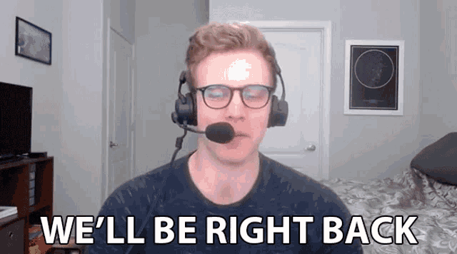 a man wearing glasses and a microphone says we 'll be right back