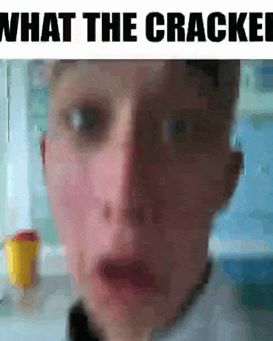 a close up of a person 's face with the words `` what the cracker '' written on the bottom .