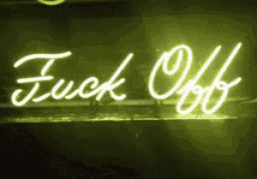 a neon sign that says fuck off is lit up