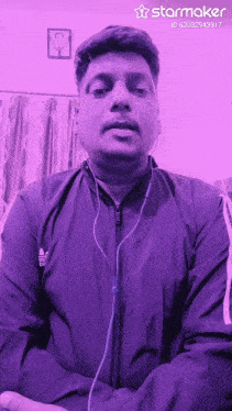 a man wearing headphones and a purple jacket has a starmaker watermark on his photo