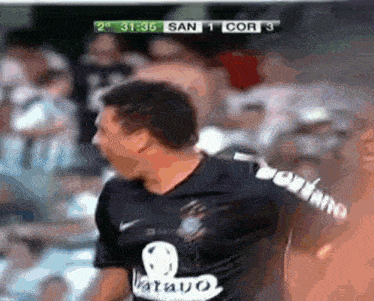 a man in a black shirt with the word bravo on the back