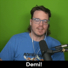 a man wearing a blue shirt that says montreal is talking into a microphone