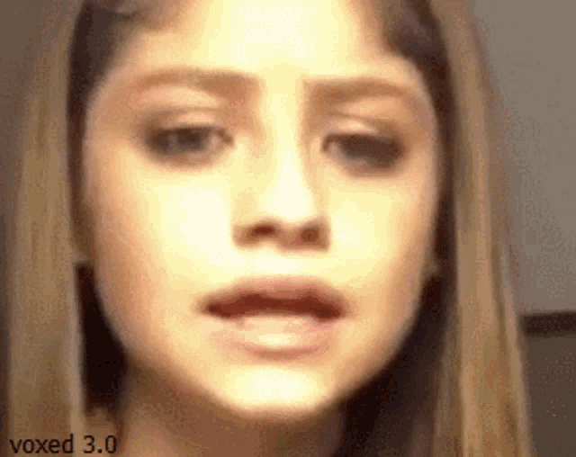 a close up of a woman 's face with the words voxed 3.0 visible