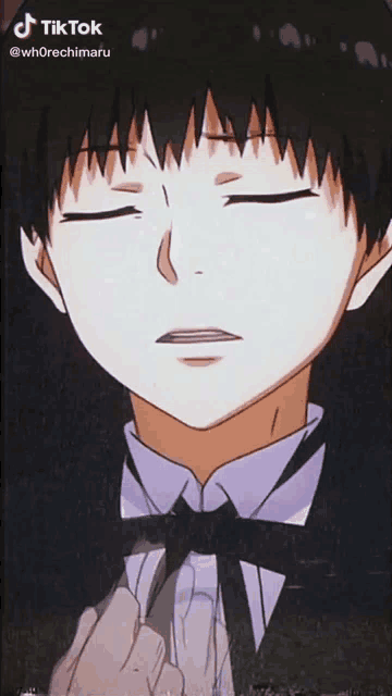a close up of a person 's face with their eyes closed .