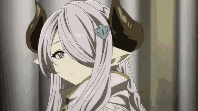 a girl with long white hair and horns is wearing a crown .