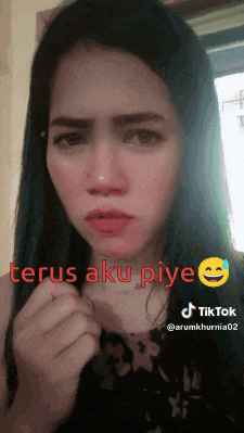 a woman is making a funny face with the words terus aku piye on the bottom