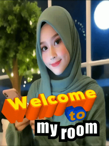 a woman wearing a green hijab is holding a cell phone and a welcome to my room sign