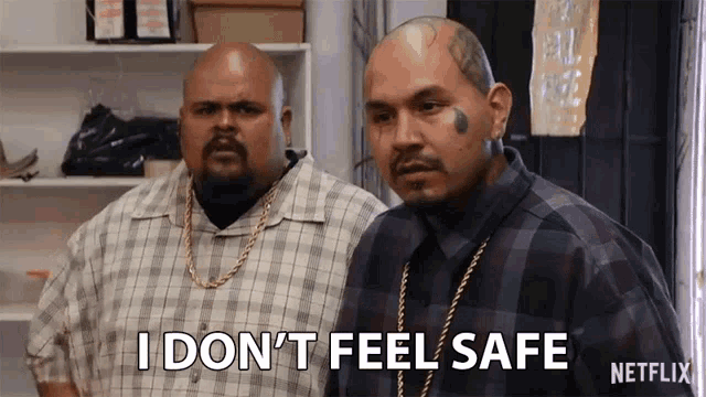 two men are standing next to each other and one of them is saying i don 't feel safe .