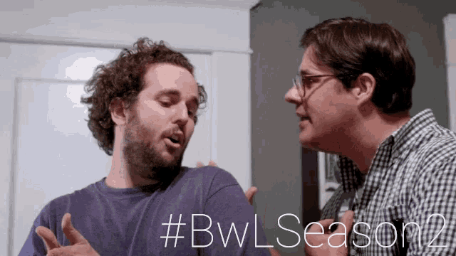 two men are having a conversation in front of a sign that says #bwl season 2