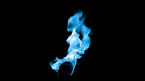 a blue flame against a black background that looks like a cross