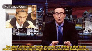 a man in a suit and tie is talking about children from other countries telling us that we 've made them fear the sky