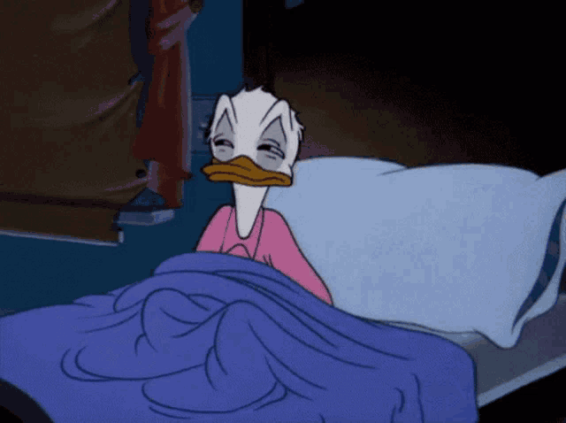 a cartoon of donald duck laying in bed with a blue blanket