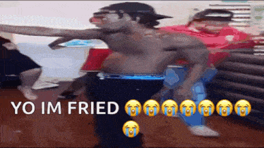 a shirtless man is dancing in a room with the words yo im fried on the bottom