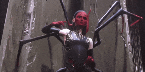 a woman with a red face is surrounded by a spider