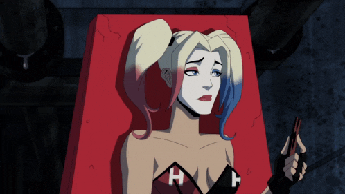 harley quinn is laying on a red box with the letter h on her shirt