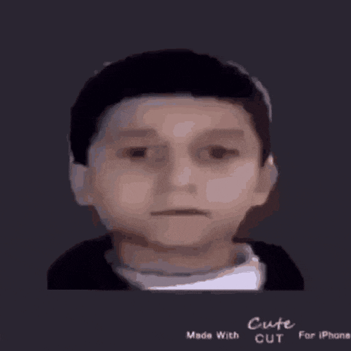 a close up of a child 's face with headphones on a black background .