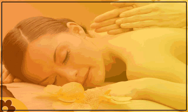 a woman is getting a massage from king thai massage