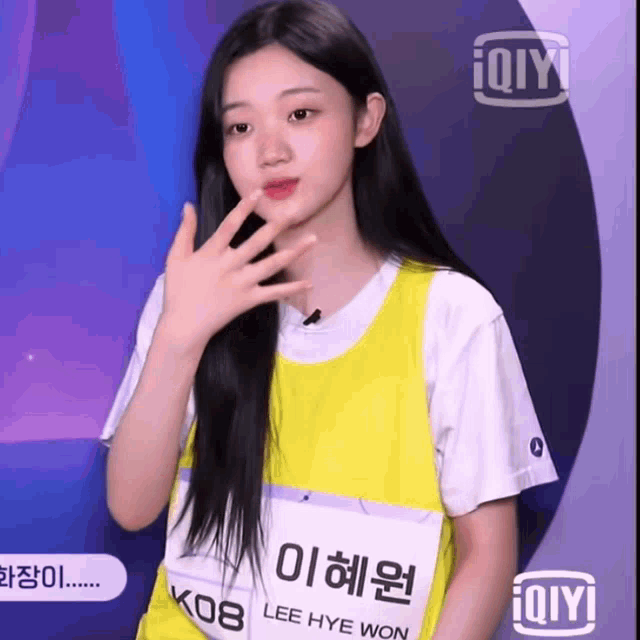 a girl with the name lee hye won is wearing a yellow shirt