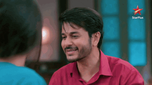 a man in a red shirt with a star plus logo on the bottom right