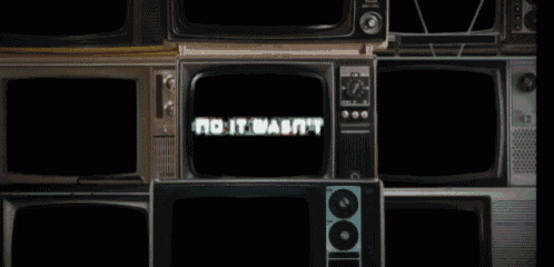 a stack of old televisions with one that says " you see i 'm just getting started "