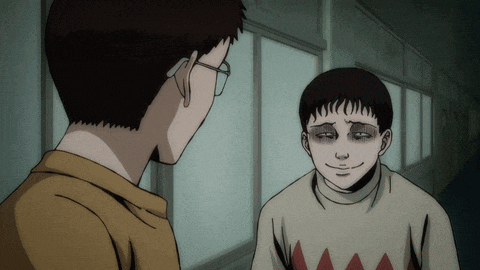 a man with glasses is talking to a boy with a sweater that has a diamond pattern on it