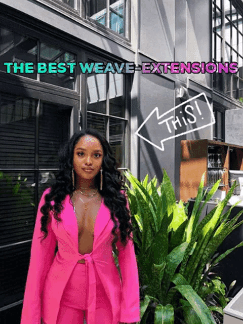 a woman in a pink suit stands in front of a building with the best weave extensions written above her