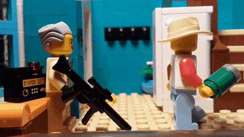 a lego man holding a gun stands next to a man holding a canister that says ' e1200 ' on it